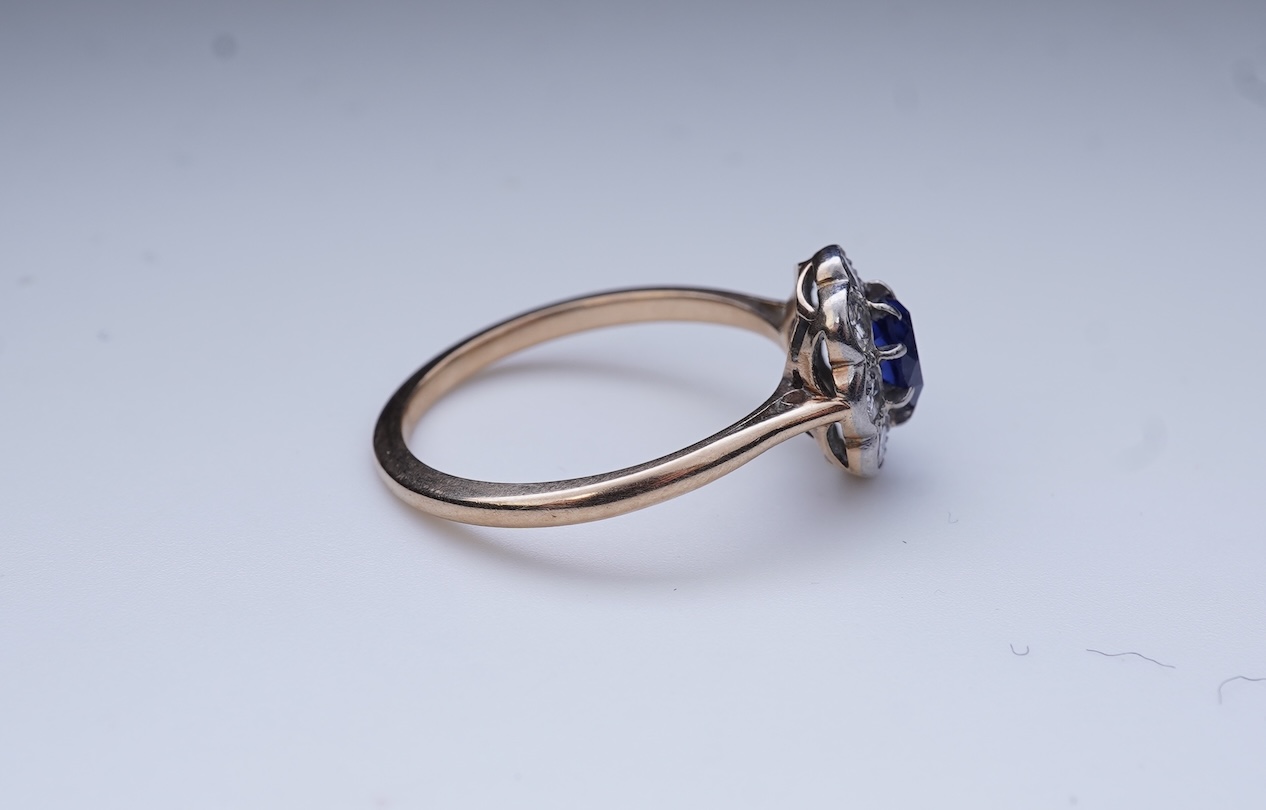 A synthetic sapphire and diamond ring